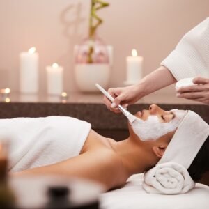 Young Woman Enjoying Facial in Spa