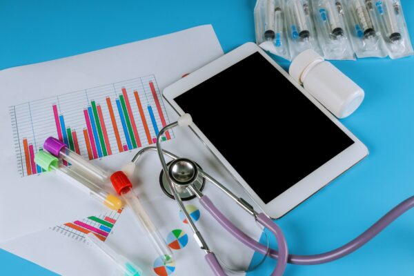 Medical statistics with tablet and stethoscope medical exam